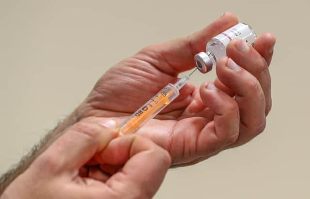 NHS staff prepare to administer a Oxford/AstraZeneca Covid-19 vaccine at the Depaul UK homeless shelter in Oldham, Greater Manchester.