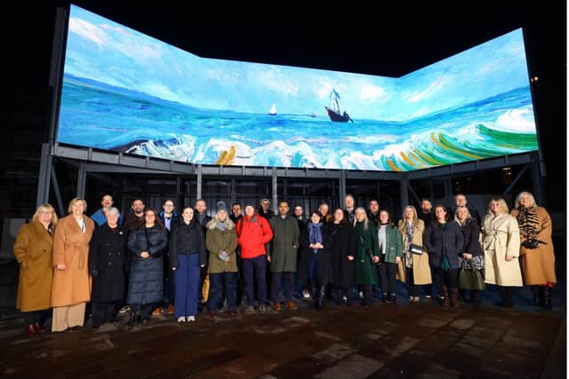 The North East 5GIR project team in front of one of UK’s largest immersive screens at Sunderland EXPO Pavilion Keel Square