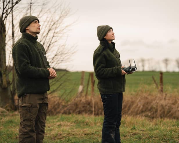 heliguy's Tom Anderson (L) and Lois Smith flying a drone