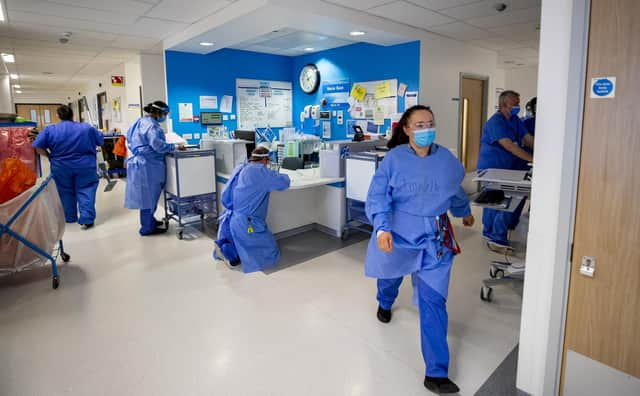 File photo dated 20/10/20 of staff on a hospital ward. Patients will suffer due to shortfalls in the number of NHS doctors and nurses, health leaders have warned. The NHS is "flying blind" over future staffing needs and a lack of planning will mean that waiting times will increase and standards of care will slip, leading medics have said. Issue date: Tuesday March 29, 2022.