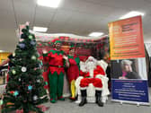 HC-One’s Careline Team consisting of Chris Kipling as Santa, David O'Hare and Donna Sowels as the elves hosting HC-One’s Support Office Christmas Fayre Fundraising Event