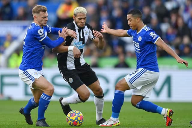 Joelinton of Newcastle United battles for possession with Kiernan Dewsbury-Hall and Youri Tielemans of Leicester City during the Premier League match between Leicester City and Newcastle United at The King Power Stadium on December 12, 2021 in Leicester, England. (Photo by Gareth Copley/Getty Images)