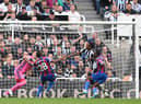 Newcastle player Joe Willock is challenged by Tyrick Mitchell and  Vicente Guaita is beaten but the goal is disallowed after a VAR review during the Premier League match between Newcastle United and Crystal Palace at St. James Park on September 03, 2022 in Newcastle upon Tyne, England. (Photo by Stu Forster/Getty Images)