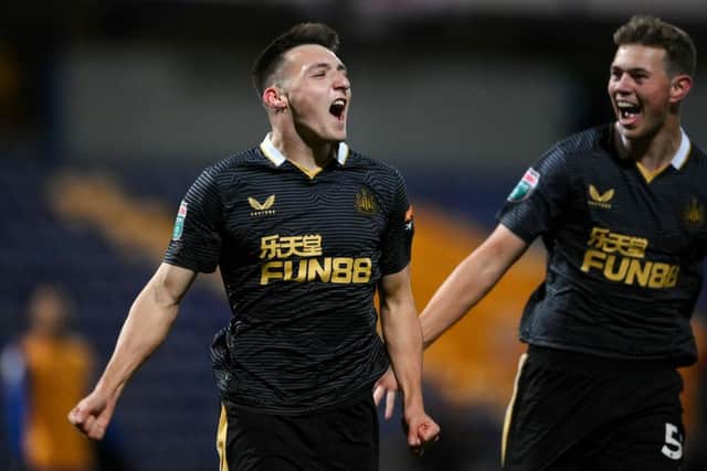 Dylan Stephenson (L) celebrates with his teammate Cameron Ferguson of Newcastle United after scoring his team's first goal during the Papa John's EFL Trophy Group match between Mansfield Town and Newcastle United U21 (Photo by Laurence Griffiths/Getty Images)