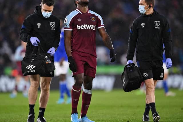 Michail Antonio of West Ham United receives medical treatment during the Premier League match between Leicester City and West Ham United at The King Power Stadium on February 13, 2022 in Leicester, England. (Photo by Laurence Griffiths/Getty Images)