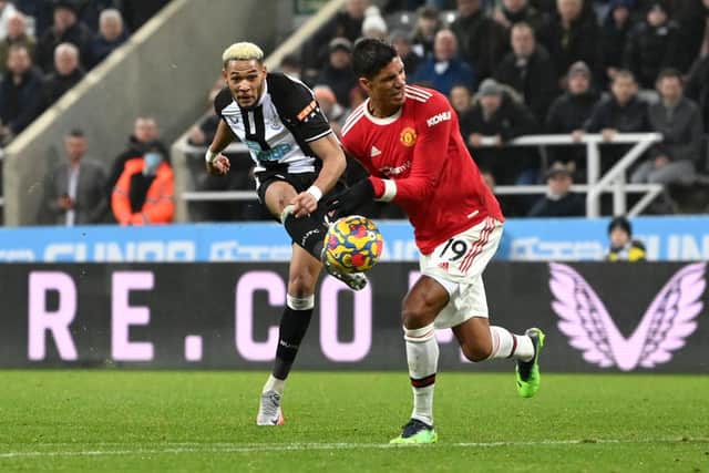 The ball hits the hand of Raphael Varane of Manchester United following a shot from Joelinton of Newcastle United during the Premier League match between Newcastle United and Manchester United at St James' Park on December 27, 2021 in Newcastle upon Tyne, England. (Photo by Stu Forster/Getty Images)