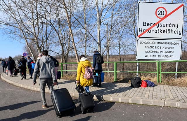 Ukrainians have left their homes in order to find safety across Europe. . (Photo by ATTILA KISBENEDEK / AFP) (Photo by ATTILA KISBENEDEK/AFP via Getty Images)