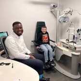 Specsavers optometrist Williams Okezie, Frankie Crow and Liam Crow