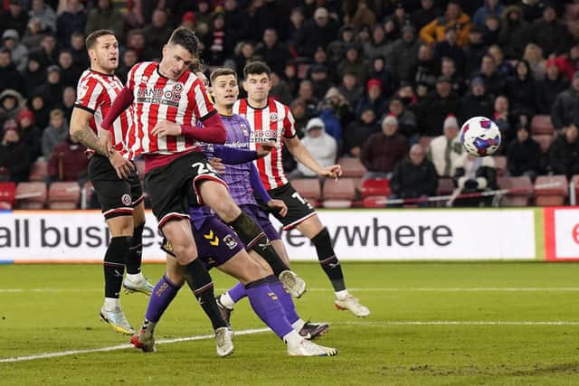 Ciaran Clark heads home for Sheffield United against Coventry City: Andrew Yates / Sportimage