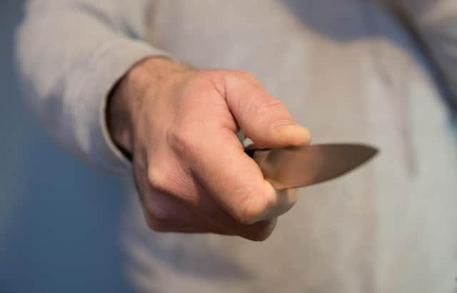 File photo dated 16/01/20 of a model poses holding a knife. Metropolitan Police Commander Alex Murray told the PA news agency that, while overall homicide figures in the English capital have dropped, the number of teen deaths has risen. Issue date: Tuesday July 27, 2021.