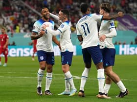 Left to right, England's Callum Wilson, Phil Foden and Marcus Rashford celebrate after Jack Grealish (right) scores their side's sixth goal of the game during the FIFA World Cup Group B match at the Khalifa International Stadium in Doha (Picture: Martin Rickett/PA)