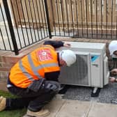 Members of the John N Dunn Group team working on an air source heat pump installation
