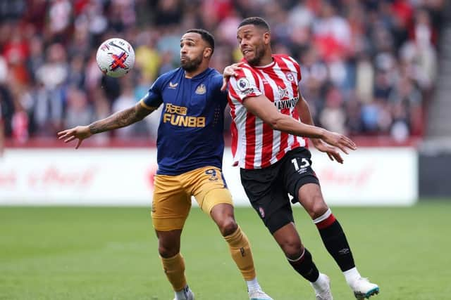 Newcastle United's Callum Wilson battles for possession.