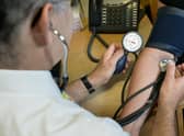 EMBARGOED TO 0001 WEDNESDAY JANUARY 18 File photo dated 10/09/14 of a GP using a stethoscope. Normalising hearing checks among adults in their 30s could help ward off some dementias in later life, experts have suggested. Issue date: Wednesday January 18, 2023.