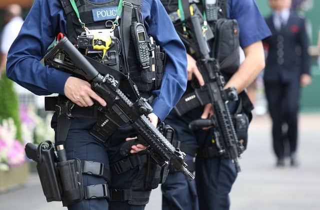Armed police on patrol near centre court on day five of the Wimbledon Championships at the All England Lawn Tennis and Croquet Club, Wimbledon.