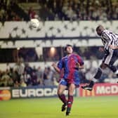 Newcastle United striker Faustino Asprilla leaps to head the third Newcastle goal and his hat trick goal during the UEFA Champions League match between Newcastle United and Barcelona at St James's Park on September 17, 1997 (Photo by Stu Forster/Allsport/Getty Images)
