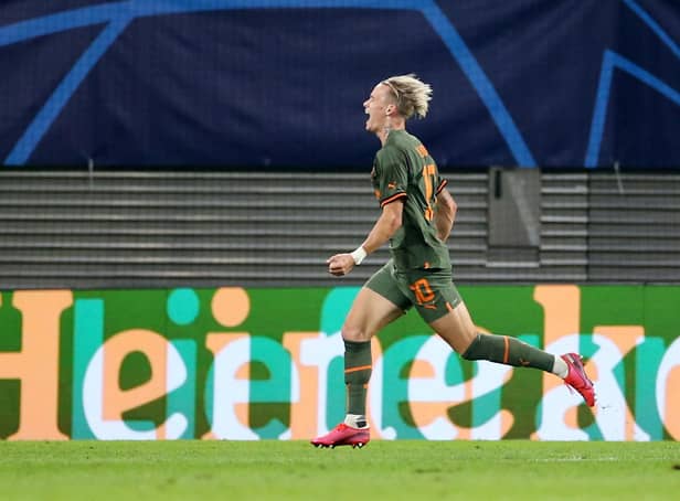 <p>LEIPZIG, GERMANY - SEPTEMBER 06: Mykhaylo Mudryk of Shakhtar Donetsk celebrates after scoring their team's third goal during the UEFA Champions League group F match between RB Leipzig and Shakhtar Donetsk at Red Bull Arena on September 06, 2022 in Leipzig, Germany. (Photo by Cathrin Mueller/Getty Images)</p>