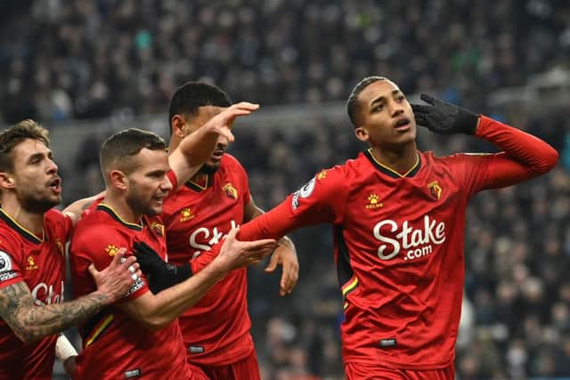 Watford player Joao Pedro (r) celebrates with team mates after scoring their goal during the Premier League match between Newcastle United and Watford at St. James Park on January 15, 2022 in Newcastle upon Tyne, England. (Photo by Stu Forster/Getty Images)