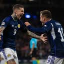 Scotland's Lyndon Dykes celebrates with Ryan Fraser after scoring to make it 2-0 during their UEFA Nations League match against Ukraine at Hampden Park. Photo by Craig Foy / SNS Group)