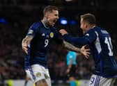 Scotland's Lyndon Dykes celebrates with Ryan Fraser after scoring to make it 2-0 during their UEFA Nations League match against Ukraine at Hampden Park. Photo by Craig Foy / SNS Group)