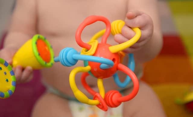 POSED BY A MODEL File photo dated 18/11/2015 of a 9-month-old girl playing with pre-school toys, London. Relatives who step up to look after a child in what is known as kinship care should be given paid leave instead of feeling forced to cut their hours or quit their jobs due to a lack of support, a charity has said. There are more than 162,000 children in England and Wales being raised by either a friend or family member other than their parents, the Kinship organisation said. Issue date: Thursday June 15, 2023.