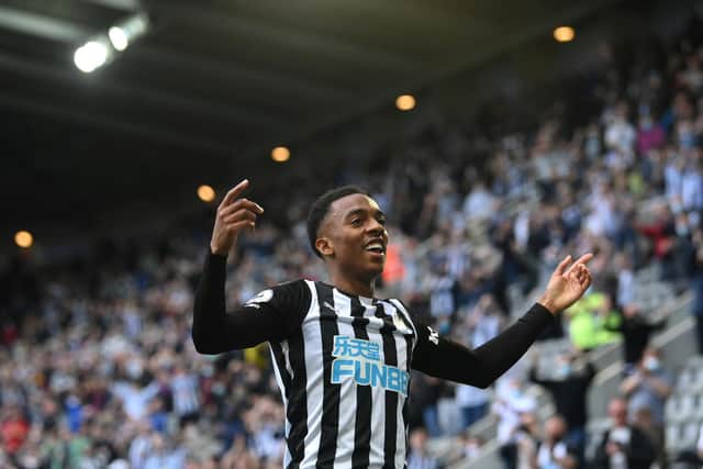 NEWCASTLE UPON TYNE, ENGLAND - MAY 19: Newcastle player Joe Willock celebrates after scoring the winning goal during the Premier League match between Newcastle United and Sheffield United at St. James Park on May 19, 2021 in Newcastle upon Tyne, England. (Photo by Stu Forster/Getty Images)