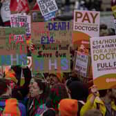 Junior doctors take part in a rally in Trafalgar Square during a nationwide strike on April 11, 2023 in London. Junior doctors in England are held a 96-hour walkout hoping to achieve full pay restoration after seeing their pay cut by more than a quarter since 2008. (Photo by Carl Court/Getty Images)
