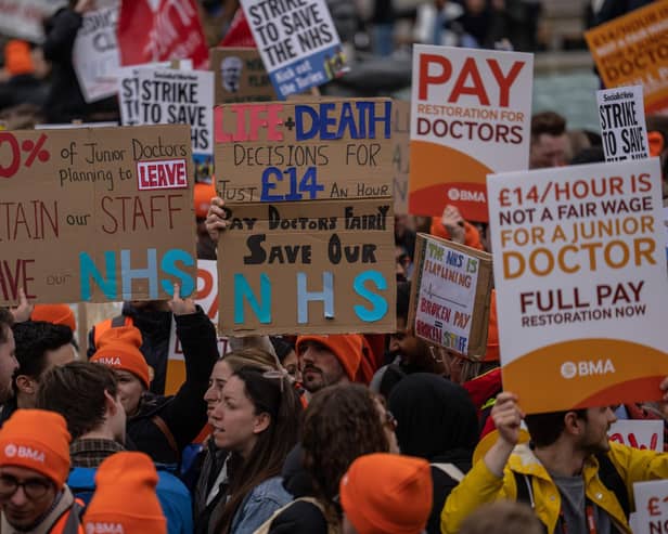 Junior doctors take part in a rally in Trafalgar Square during a nationwide strike on April 11, 2023 in London. Junior doctors in England are held a 96-hour walkout hoping to achieve full pay restoration after seeing their pay cut by more than a quarter since 2008. (Photo by Carl Court/Getty Images)