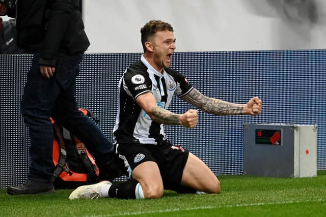 Kieran Trippier of Newcastle United celebrates after scoring their sides third goal during the Premier League match between Newcastle United and Everton at St. James Park on February 08, 2022 in Newcastle upon Tyne, England. (Photo by Stu Forster/Getty Images)