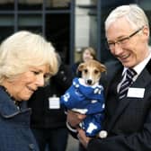 File photo dated 12/12/12  the Queen Consort, then the Duchess of Cornwall, with television presenter Paul O'Grady during her visit to Battersea Dogs & Cats Home in London.