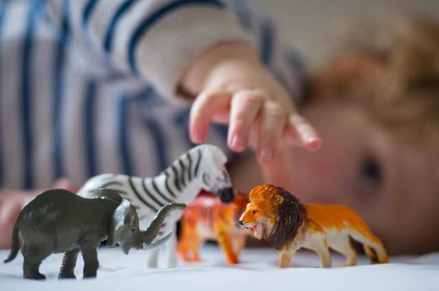 File photo dated 24/01/16 of a preschool age child playing with plastic toy animals. Blocks on childminders looking after children in their rental properties should be lifted to help boost numbers in the sector, Children's minister Claire Coutinho has told landlords. Issue date: Monday August 21, 2023.