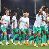 Jacob Murphy of Newcastle United celebrates with teammate Alexander Isak after scoring the team's fourth goal during the Premier League match between Everton FC and Newcastle United at Goodison Park on April 27, 2023 in Liverpool, England. (Photo by Alex Livesey/Getty Images)