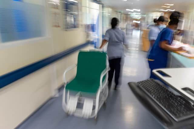 File photo dated 18/01/23 of a general view of staff on a NHS hospital ward, as England's hospitals have been hit by hundreds of sewage leaks in the last year, records detailing patients slipping on water and ceiling tiles falling down have revealed.