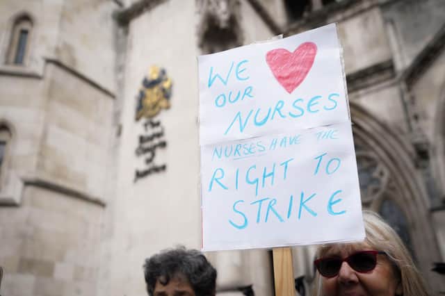 Nurses outside the High Court in central London, where the Government is bringing a challenge over the planned strike action by the Royal College of Nurses (RCN) in the long-running dispute over pay. Health Secretary Steve Barclay has said he was "regretfully" applying to the High Court to declare the walkout planned for May 2 unlawful. Picture date: Thursday April 27, 2023.
