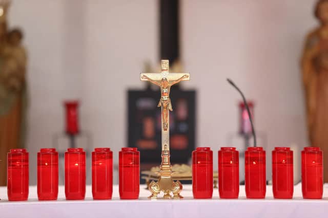 Ten candles are lit at the altar of St Michael's church in the village of Creeslough in Co Donegal for the victims of the explosion at Applegreen service station on Friday. Picture date: Monday October 10, 2022.