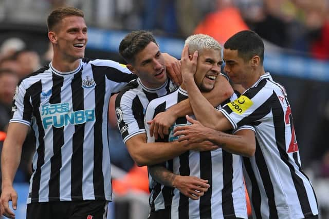 Newcastle player Bruno Guimaraes (2nd r) celebrates his second goal with Sven Botman (l) Fabian Schar and Miguel Almiron (r) during the Premier League match between Newcastle United and Brentford FC at St. James Park on October 08, 2022 in Newcastle upon Tyne, England. (Photo by Stu Forster/Getty Images)