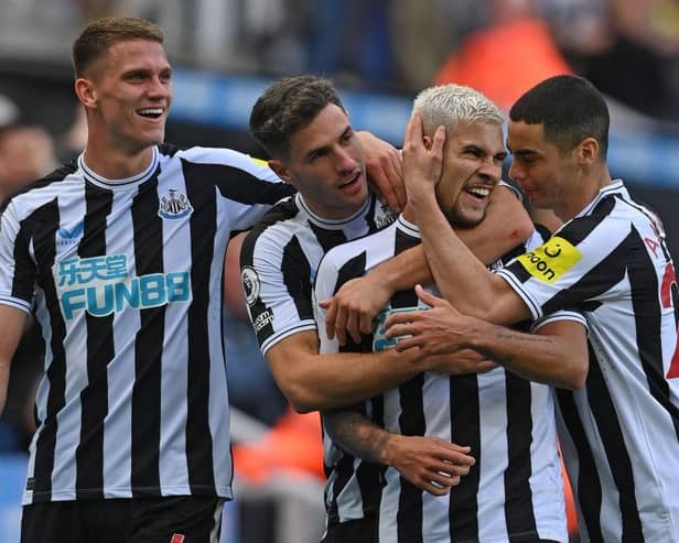 Newcastle player Bruno Guimaraes (2nd r) celebrates his second goal with Sven Botman (l) Fabian Schar and Miguel Almiron (r) during the Premier League match between Newcastle United and Brentford FC at St. James Park on October 08, 2022 in Newcastle upon Tyne, England. (Photo by Stu Forster/Getty Images)
