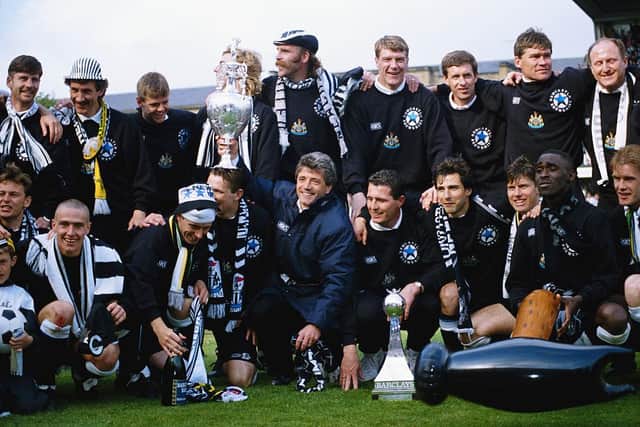 Newcastle United manager Kevin Keegan holds the League Division One trophy after the League Division One match against Leicester City at St James' Park on May 9, 1993 in Newcastle, England
