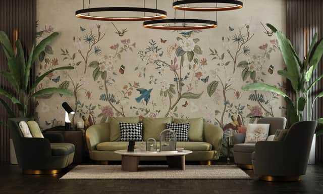 The wallpaper creates a stunning backdrop in this well balanced room.