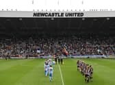 The two teams enter the field to a packed East Stand, part of a 22,000 crowd before the FA Women's National League Division One North match between Newcastle United Women and Alnwick Town Ladies at St James' Park on May 01, 2022 in Newcastle upon Tyne, England. (Photo by Stu Forster/Getty Images)