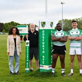 Jamilah Hassan, community relations manager at the Banks Group, with members of Gosforth Rugby Football Club