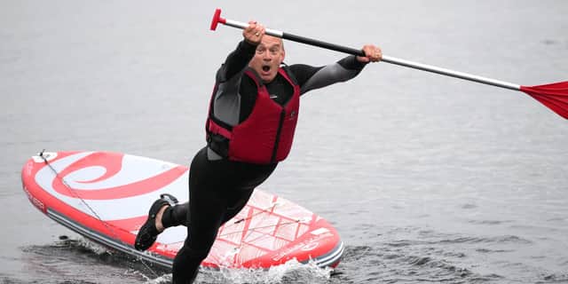 Lib Dem leader Sir Ed Davey falls into lake.