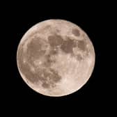 The first full moon of the year will be seen on Monday (Photo by Olivier DOULIERY / AFP) (Photo by OLIVIER DOULIERY/AFP via Getty Images).