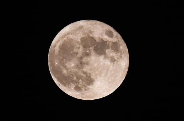 The first full moon of the year will be seen on Monday (Photo by Olivier DOULIERY / AFP) (Photo by OLIVIER DOULIERY/AFP via Getty Images).