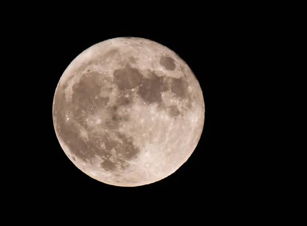 The first full moon of the year will be seen on Monday (Photo by Olivier DOULIERY / AFP) (Photo by OLIVIER DOULIERY/AFP via Getty Images).