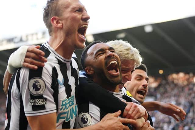 Newcastle United's Callum Wilson celebrates his goal with Dan Burn.