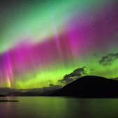 Aurora Borealis, also known as the Northern Lights, putting a show on dancing over Loch Glascarnoch, by Garve, in the Highlands