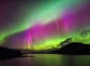 Aurora Borealis, also known as the Northern Lights, putting a show on dancing over Loch Glascarnoch, by Garve, in the Highlands