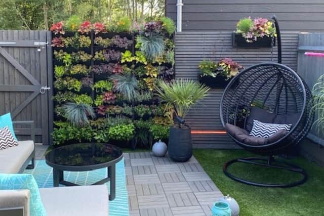 A wall of greenery or flowers can completely transform a dull corner of the garden