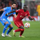 LIVERPOOL, ENGLAND - NOVEMBER 03: Sadio Mane of Liverpool holds the ball whilst under pressure from Felipe of Atletico Madrid during the UEFA Champions League group B match between Liverpool FC and Atletico Madrid at Anfield on November 03, 2021 in Liverpool, England. (Photo by Laurence Griffiths/Getty Images)